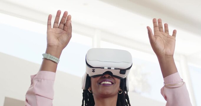 African American woman putting on white VR headset, tracing virtual objects at home with mint watch