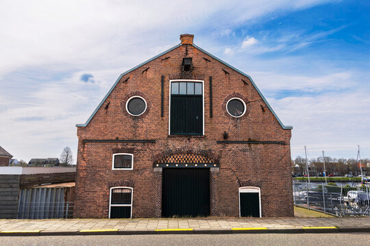 A hangar at a harbour in the Netherlands, built of red brick