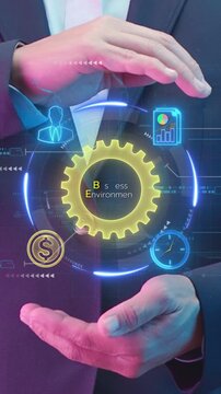 Business Environment concept, the sum total of all external and internal factors that influence a business. Businessman shows glowing neon line of Business Environment icon on virtual screen.