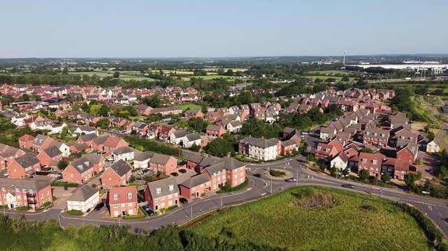 Aerial drone footage of Three Mile Cross in Berkshire, England, showcasing residential neighbourhoods, surrounding countryside, and suburban development