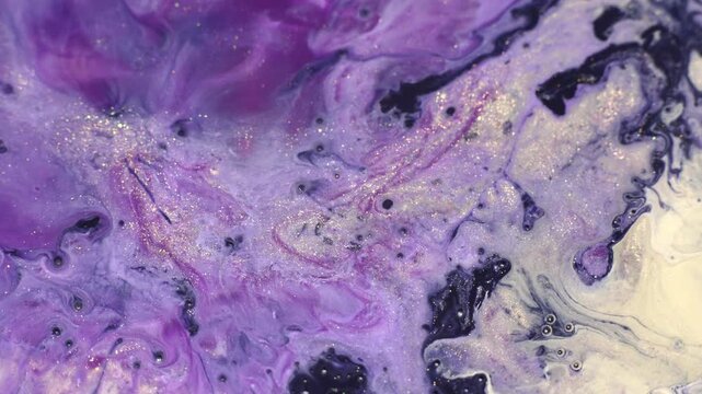 Dynamic abstract macro video of flowing acrylic paint texture