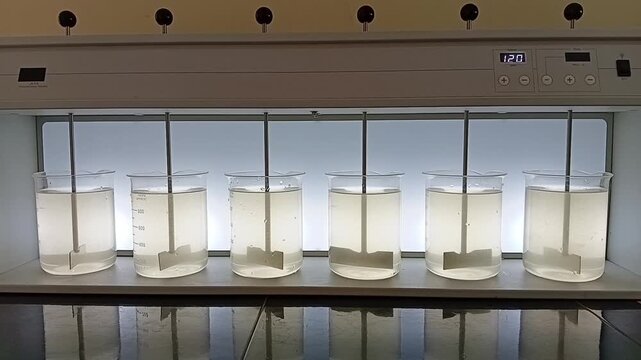 Water Treatment Laboratory Jar Test Apparatus Showing Coagulation and Flocculation Chemical Mixing Process in Beakers