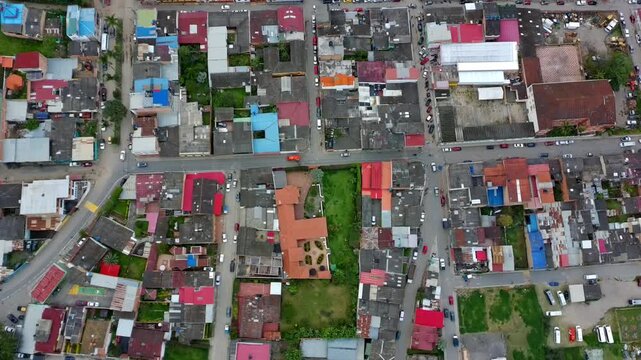 Top-down aerial drone hover over colorful Choachi rooftops and streets
