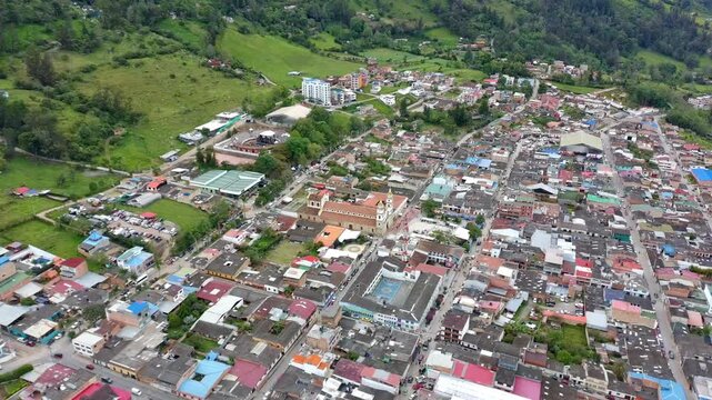 Aerial Drone Tracking Over Choachi Rural Town in Green Mountain Valley
