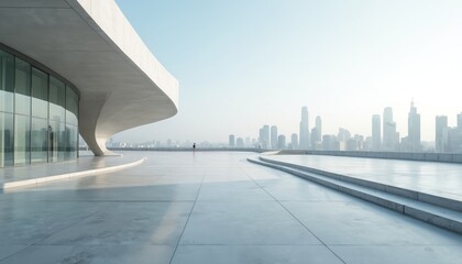 Obraz premium Modern building with glass facade overlooks city skyline from spacious concrete terrace. Minimalist architectural design offers expansive urban view. Quiet outdoor space features clean lines,