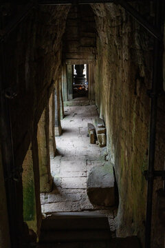 A long corridor of ancient stone doorways at Bayon Temple, Angkor Wat, Siem Rep, Cambodia., creates a sense of depth and mystery.