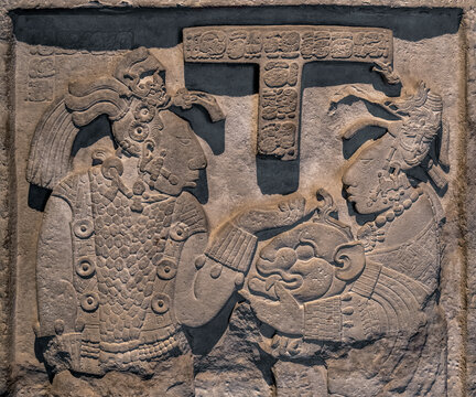 Lintel 26 with Queen Kabal Xook giving a jaguar head helmet to king Itzamnaaj Balam II, Yaxchilan, Chiapas, Mexico.