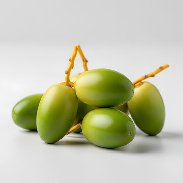 Fresh green dates fruit bunch on white background studio shot.