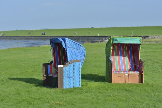 Roofed wicker beach chairs at the H&ouml;rn swimming spot, Pellworm, North Frisia, Schleswig-Holstein, Germany