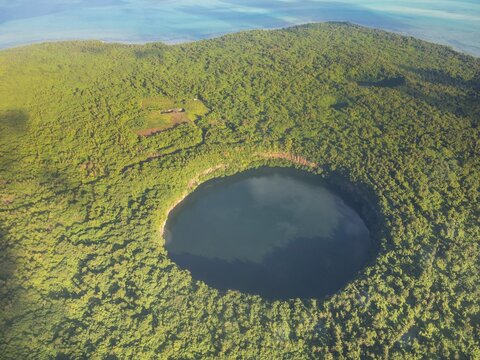 Aerial of Lalolalo lake volcanic crater lake, center of Wallis, Wallis and Futuna