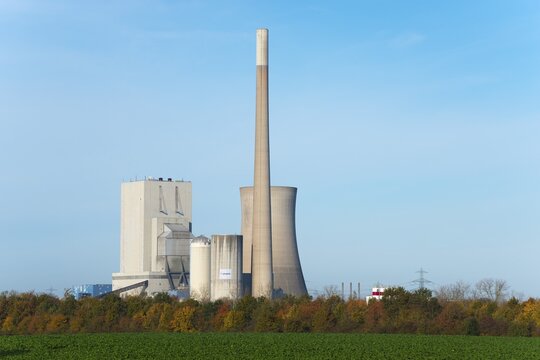 Industrial plant with chimney and cooling tower in autumn landscape under blue sky, Mehrum coal-fired power station, Peine district, Lower Saxony, Germany