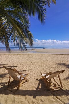 Sun loungers on the beach of Andilana, Island of Nosy Be, Madagascar, Indian Ocean