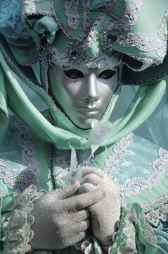 Portrait of turquoise green mask at carneval in Venice, Italy