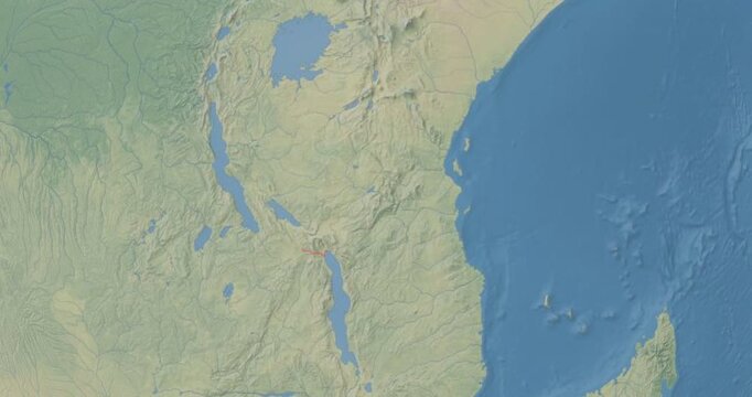 Tanzania on Globe. Zoom into the country with Earth spinning on dark background. Physical world map with Tanzania and label on it. Country view animation.