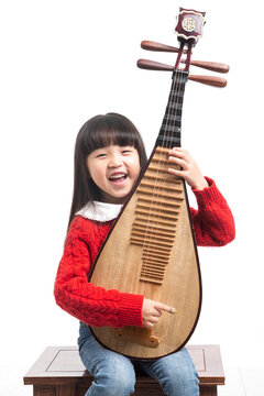 Asian little girl playing pipa, traditional Chinese musical instrument, happy child learning music