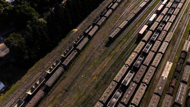 Aerial view of a large rail yard with multiple parallel tracks and parked freight trains, industrial logistics infrastructure in Rosario, Argentina