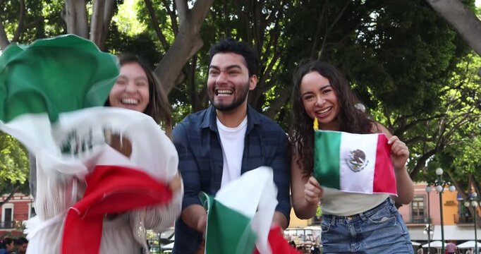 Mexican people holding flags to celebrate  independence day in Mexico City