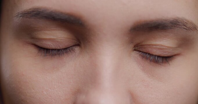Intimate close-up of young woman's eyes showing nuanced emotions