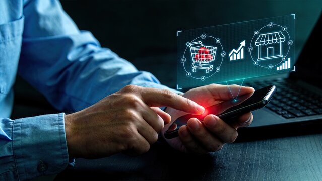 Person using smartphone with futuristic hologram interface, online shopping cart icon, e-commerce sales growth graph, digital marketing concept, mobile app store, cyber business