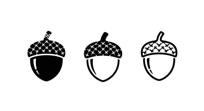 Three stylized black and white acorn icons set.
