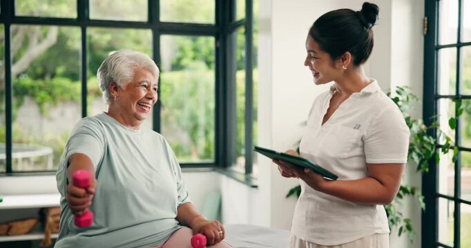 Physical therapy, dumbbells or old women with tablet in clinic, medical recovery evaluation or arm exercise. Speaking, tech or people with injury assessment for healing progress, thumbs up or smile