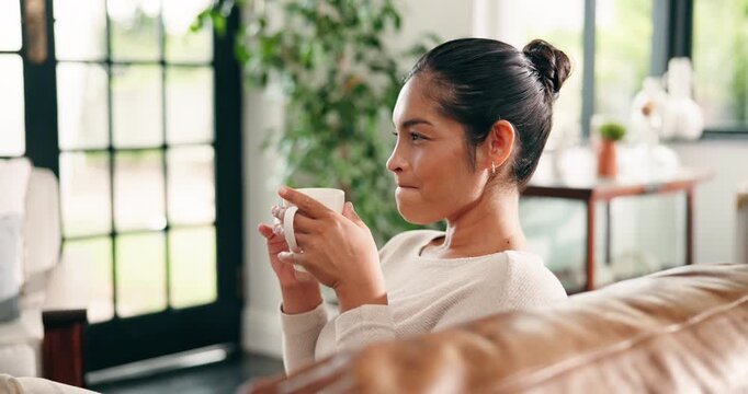 Happy, woman and thinking with coffee on sofa to start morning, daydreaming and remember memory. Home, person and thoughtful with beverage in living room for weekend break, self reflection and relax