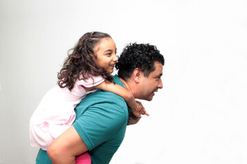 Fototapeta premium 40-year-old divorced single dad and his Latina daughter play and have fun to celebrate Father's Day