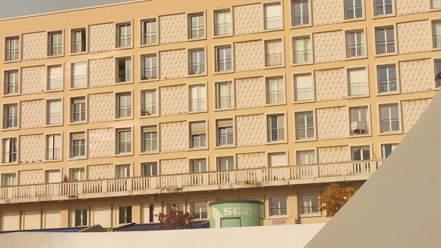 A large modernist apartment block with repetitive window grid and balconies in Le Havre.