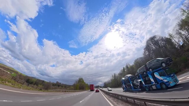Ultra Wide Time Lapse. Car Travel on British Highways During Mostly sunny Day. Car Mounted Camera View of British Road Travel and Traffic on British Motorways and Highways of England Great Britain