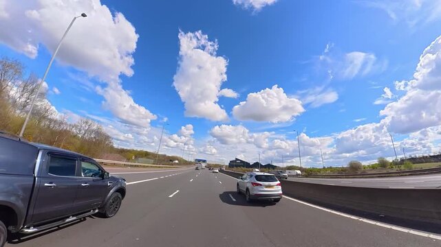 Ultra Wide Time Lapse. Car Travel on British Highways During Mostly sunny Day. Car Mounted Camera View of British Road Travel and Traffic on British Motorways and Highways of England Great Britain