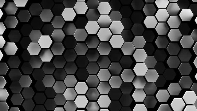 3d rendered honeycomb background of patterned hexagons. High contrast black and white hex shapes moving in a loop. Random hexagonal patterns for futuristic, scientific, or technical backgrounds.