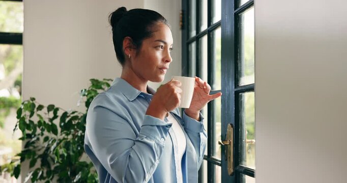 Glass door, woman and thinking with coffee in home to start day, check weather and reflection. Calm, person and thoughtful with hot beverage in apartment for peaceful morning, daydreaming and memory