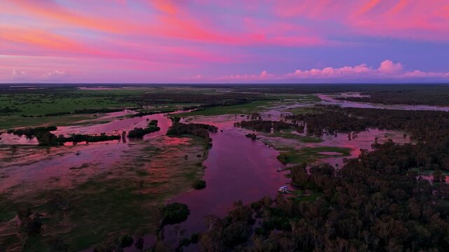 Aerial Wetland and River Under Vivid Pink Purple Sunset Sky Kakadu National Park Australia