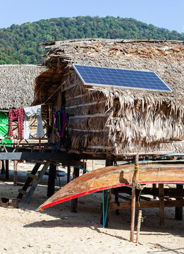 Moken Sea Gypsy Village. Traditional hut with solar panel. Koh Surin, Thailand. Tropical beach setting.