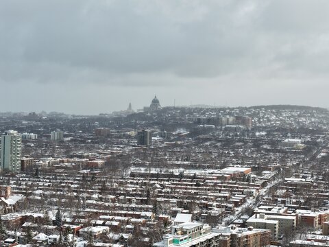 Saint Josephs Oratory dome above snowy Westmount and Montreal neighborhood on Mount Royal hill in winter, Quebec, Canada. g.