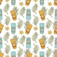 Seamless pattern with tiki mask and palm leaf © Mariia
