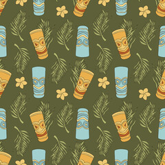 Seamless pattern with tiki mask and palm leaf © Mariia