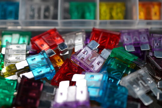 Multicolored fuses with the amperage required for automobiles and their electrical functions.