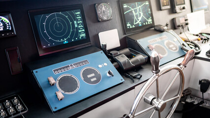 Digital dashboard with navigation monitor system, radar and VHF Radio in ship captain bridge or boat engine control room. Wheelhouse steering console on maritime transport. Nautical vessel technology © zephyr_p