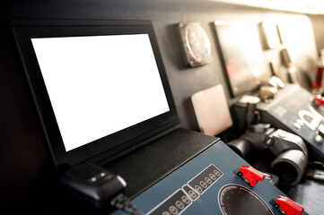 Blank monitor screen of GPS navigation and marine radar system with VHF Radio and binoculars on boat dashboard in wheelhouse or ship captain bridge. Maritime transport. Nautical vessel technology © zephyr_p