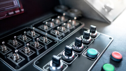 Toggle switches, knob switches and buttons on the boat dashboard. Control panel of vessel transport system. Modern boating technology © zephyr_p