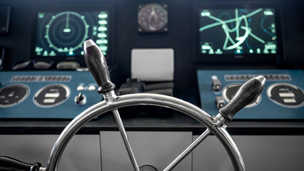 Wheelhouse steering console with digital dashboard of GPS navigation monitor, compass and marine radar system in ship captain bridge or boat control room. Nautical vessel technology © zephyr_p