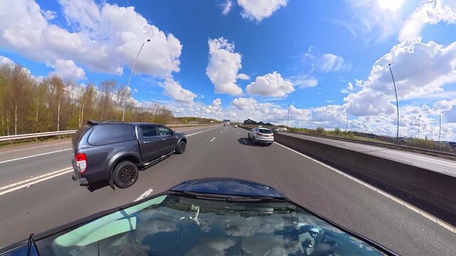Ultra Wide Time Lapse. Car Travel on British Highways During Mostly sunny Day. Car Mounted Camera View of British Road Travel and Traffic on British Motorways and Highways of England Great Britain
