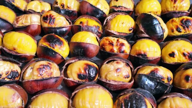 Roasted chestnuts being prepared at a street market