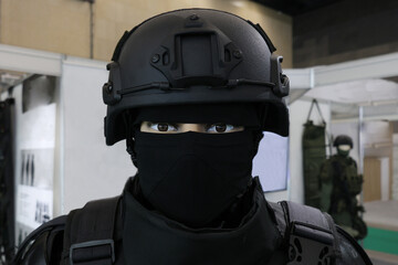 Obraz premium Black tactical gear covers all but eyes