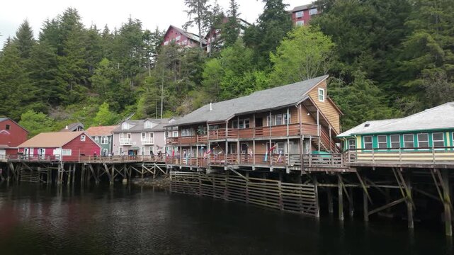Houses in Ketchikan Creek line the waterfront, creating a colorful, historic scene unique to Alaska. Nearby, the Salmon Walk offers cruise tour guests a chance to watch salmon spawn and explore local 