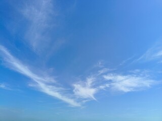 Obraz premium a sprinkling of white clouds in the blue sky