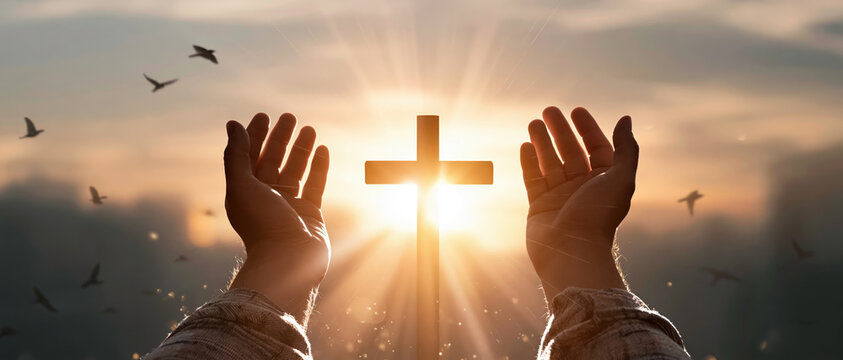 Prayer worship faith hope sunrise cross christian belief hands raised toward glowing cross with hopeful light and flying birds in sky
