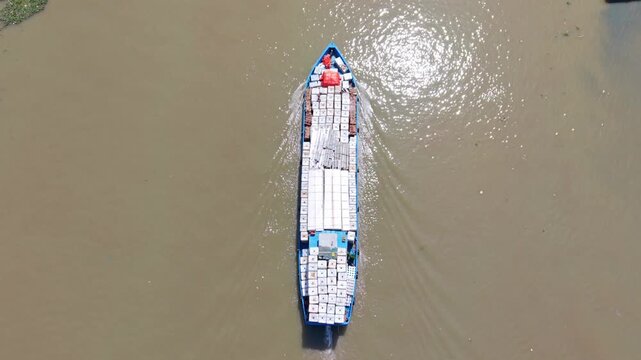 Market Boat Approaches Dock Amid Hyacinth. Morning Scene Of Boat With Goods At Floating Dock. Overhead Shot Of Market Boat Docking Surrounded By Floating Hyacinth In Morning