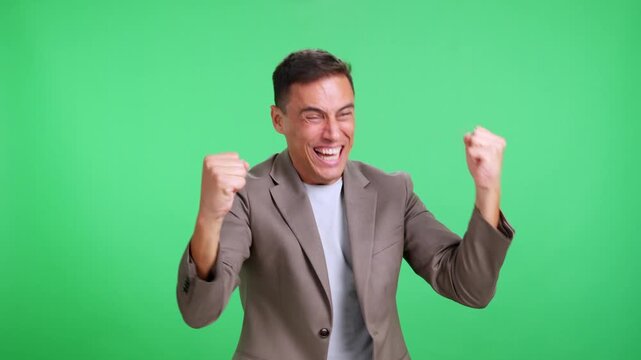 Businessman celebrating a mistake on green screen